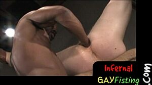 Interracial gay couple explores rough BDSM with fisting and stretching